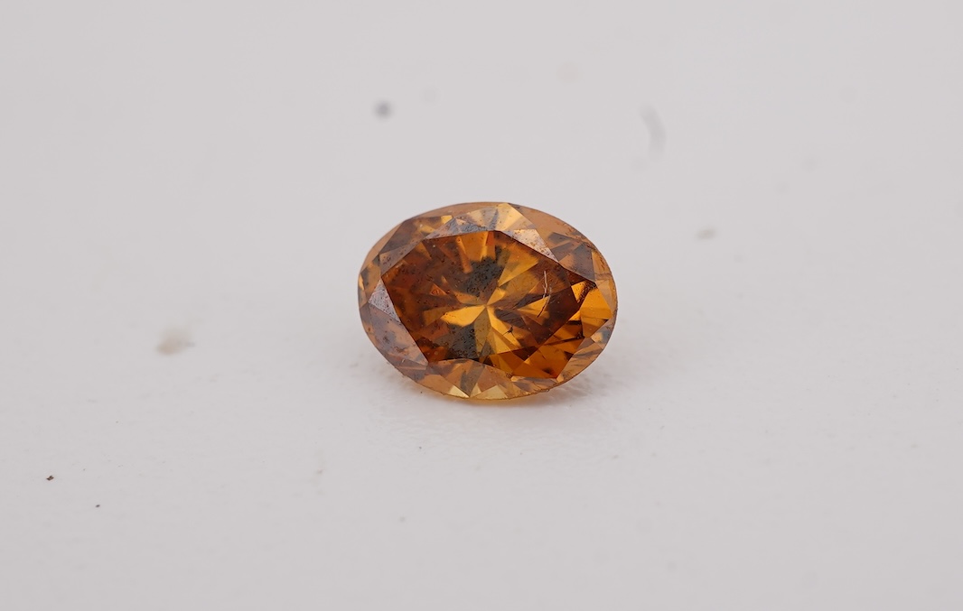 An unmounted Fancy Deep Brown-Orange diamond, the oval natural diamond measuring 5.3 x 3.9 x 2.5mm, with treated colour, weighing 0.34 carats, Accompanied by GIA report no. 6233434030, stating that the Fancy Deep Brown-O